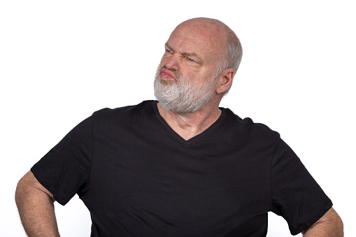 Suspicious Middle-Aged Man in Black T-Shirt - Stylish Portrait on White Background