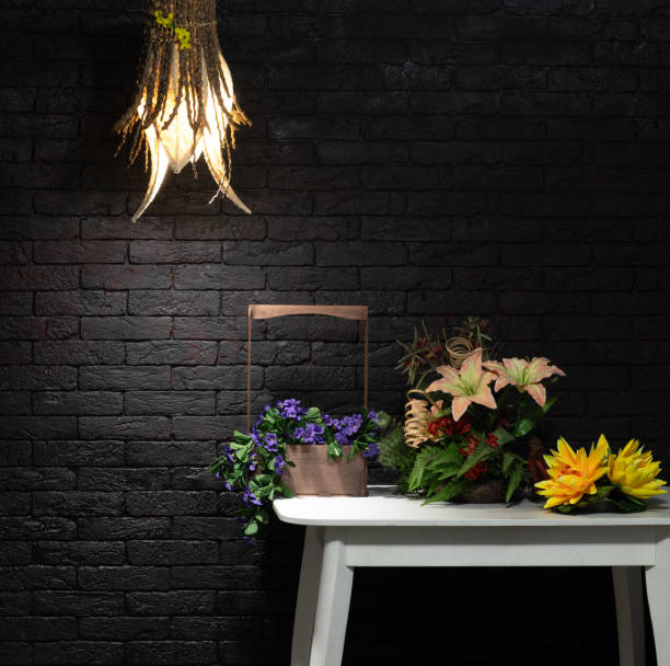 bamboo chandelier lamp and flowers on the table