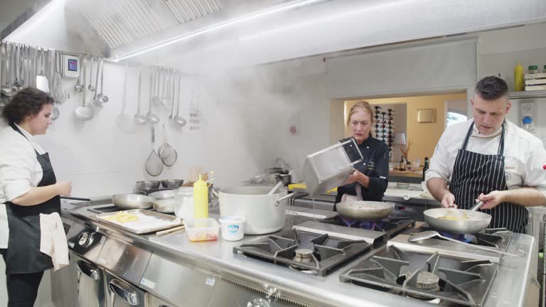 Chefs are cooking in the restaurant's kitchen