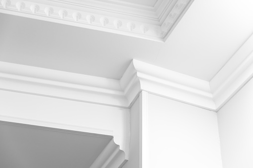 Abstract white architecture background, interior fragment with ceiling corner decoration