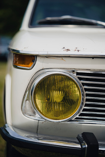 Close-up of a vintage car headlight Retro vintage cars under the lights.