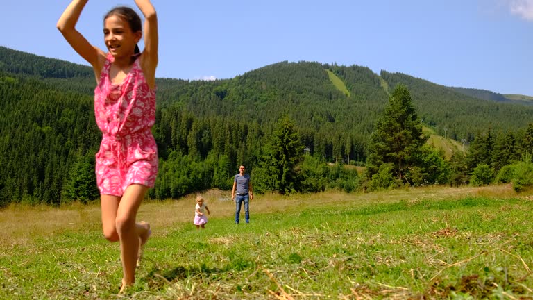 family flying a kite. Selective focus. people.