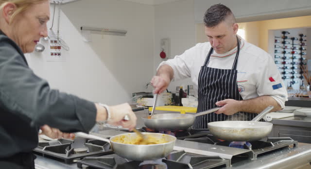 Chefs are cooking in the restaurant's kitchen