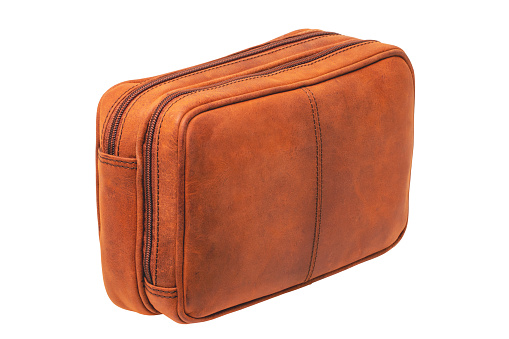 Leather handbag isolated. Close-up of brown businessman luxury leather wrist handbag. Clipping Path. Fashionable brown leather briefcase or bag for men.