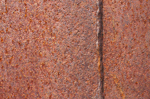 red textured rusty metal background with close up