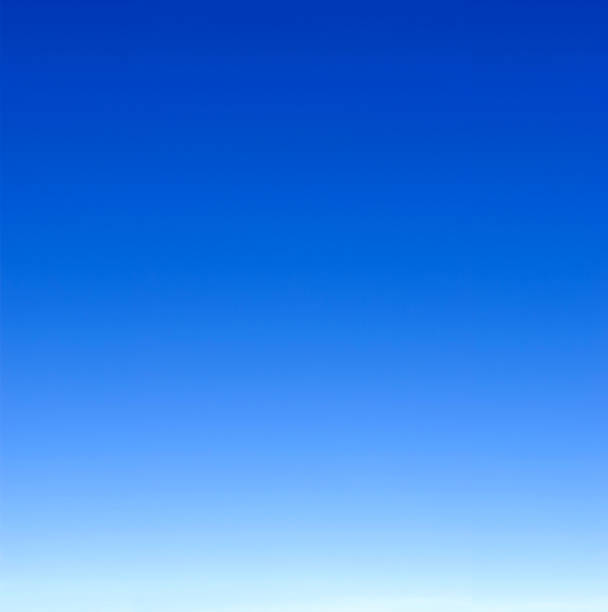 istock empty blue sky fading from white on the horizon to dark blue 1978186574