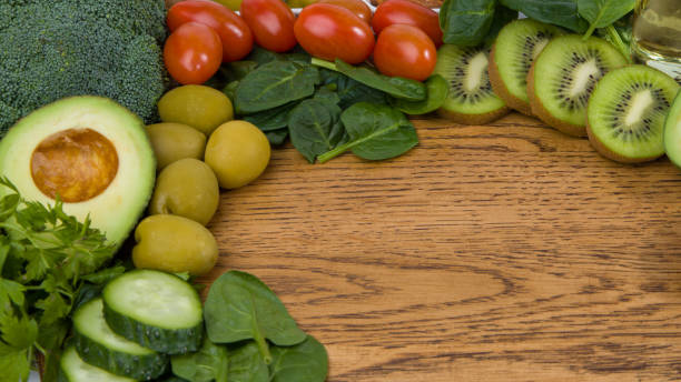 istock Fresh vegetables and fruits on a wooden background. 1978212629