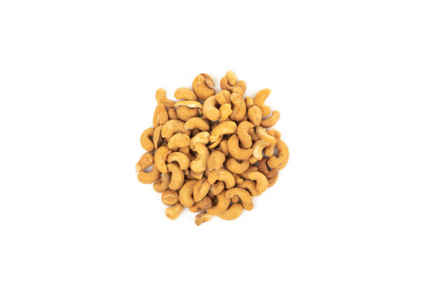 istock Heap of cashew nuts isolated on a white background 1978248515