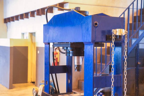 industrial hydraulic press medium size, in an workshop, small business entrepreneur