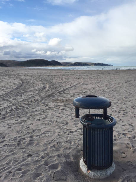 istock Dustbin in beach. Garbage can in beach with sea and sky background 1978293650