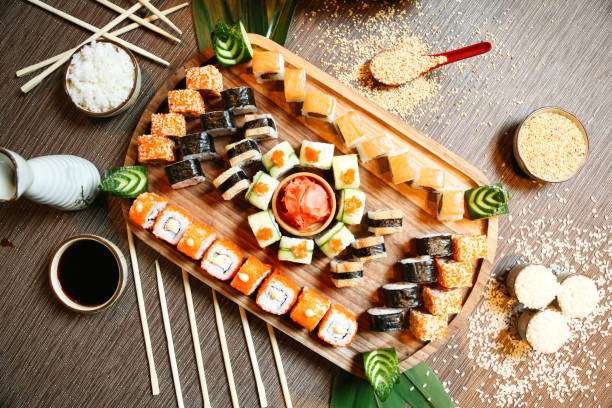 istock Wooden Tray Topped With Sushi and Chopsticks 1978296413