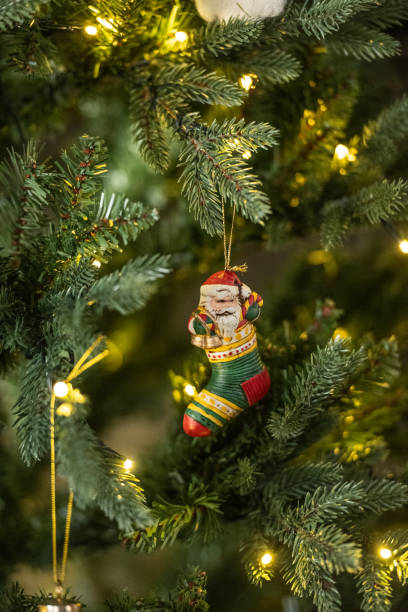 istock Christmas ornament hanging from a christmas tree.. 1978313389