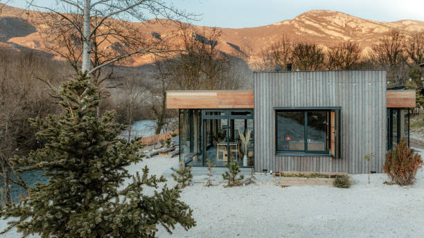 istock Cabin house on a riverbank 1978315542