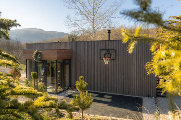 Photo of a wooden cabin house on riverbank