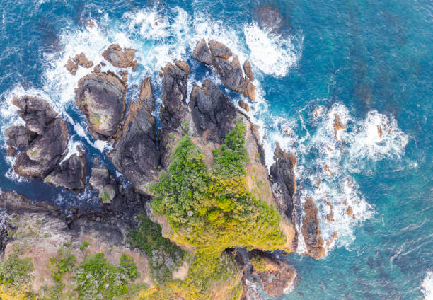 istock Sea waves and rocks in a splashy duet. 1978344535