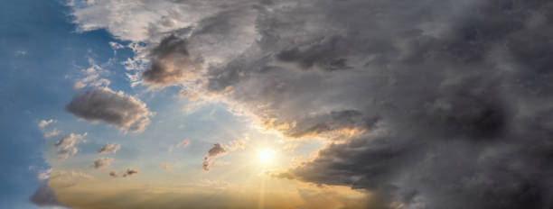 split sky between a storm and sunny day, at the edge of the rain cloud