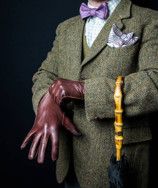istock British Gentleman in Tweed Suit Pulling on Leather Gloves 1978372770