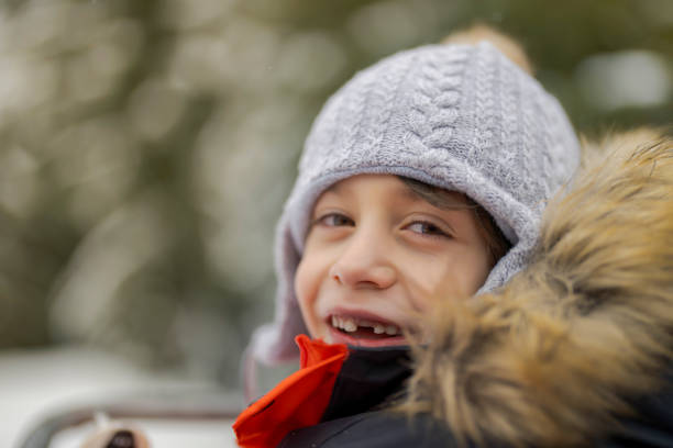 Portrait of cute happy boy on chair lift