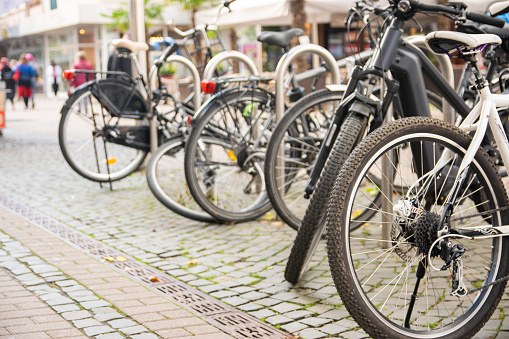 Urban streets with bikes. Bikes stay on Bicycle parking in Germany.