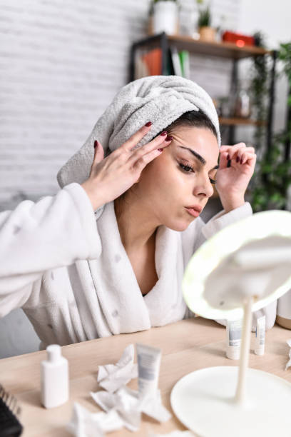 istock Female Using Skin Moisturizer To Postpone Crow's Feet 1978429561