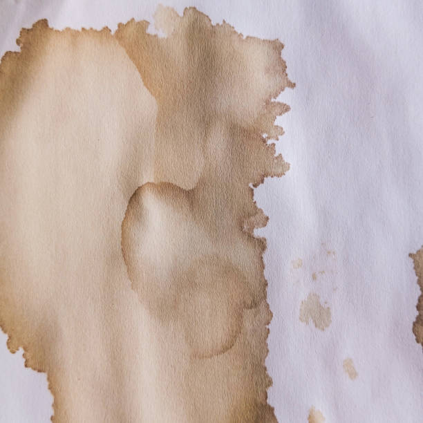 istock Abstract brown coffee grunge background. Hand made abstract artwork. Abstract brown paint wallpaper. Coffee stains, blobs and drops on white paper. 1978492803