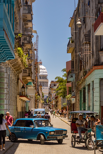 View of an urban scene of a Havana street with the Capitol in the background