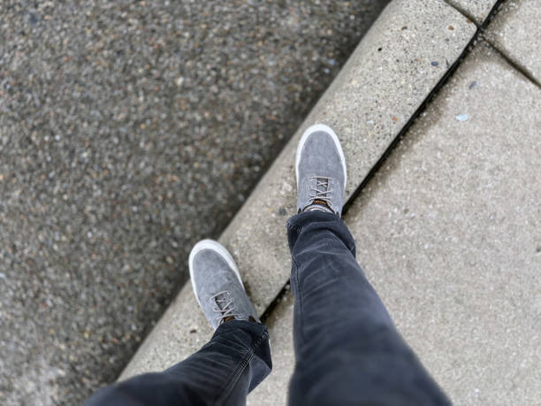 Standing on a Curb stock photo