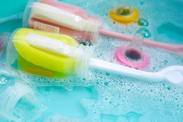 istock Wash baby bottles in plastic blue basin 1978583180