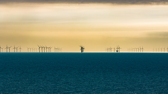 Electric generating windmills in a sea, alternative energy, Brighton, East Sussex, UK