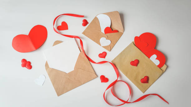 istock Valentine's Day, a note in a paper heart envelope. Top view. Copy space. Place for text 1978613174