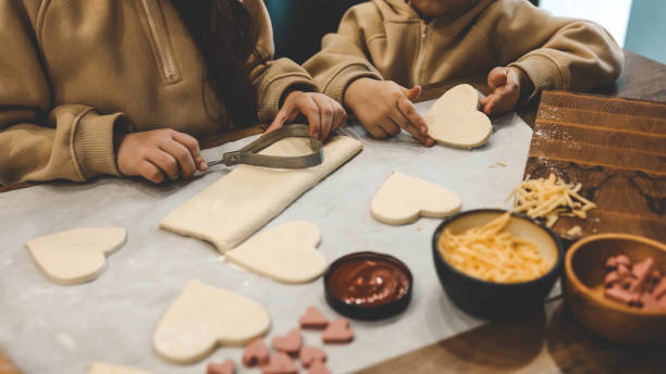 istock Children making pizza in the kitchen 1978626181