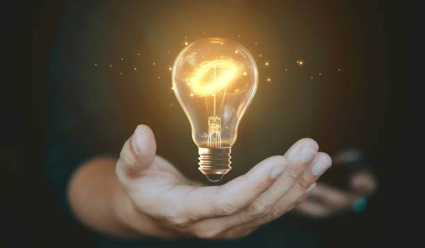 istock Idea concept with light blub on hand, innovation, inspiration and creative. 1978644031