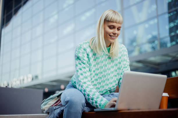 istock A happy college girl is working on a project at campus. 1978647696