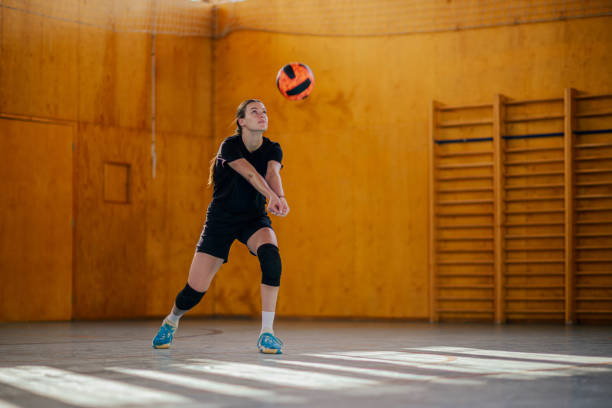 istock A volleyball player is passing the ball and practicing on court. 1978649358