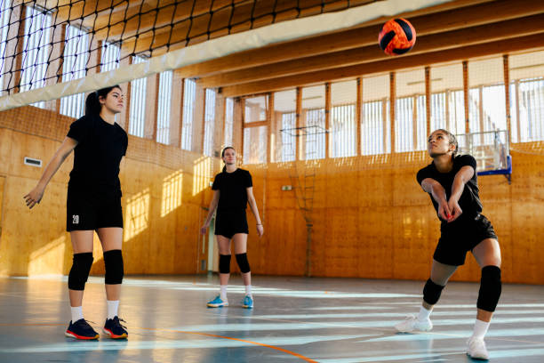 istock A young interracial volleyball team is practicing on indoor court. 1978649361