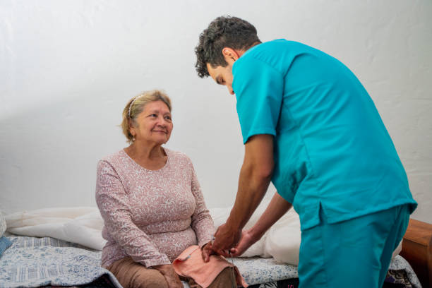 istock Nurse caring for an elderly lady in a retirement home 1978665604