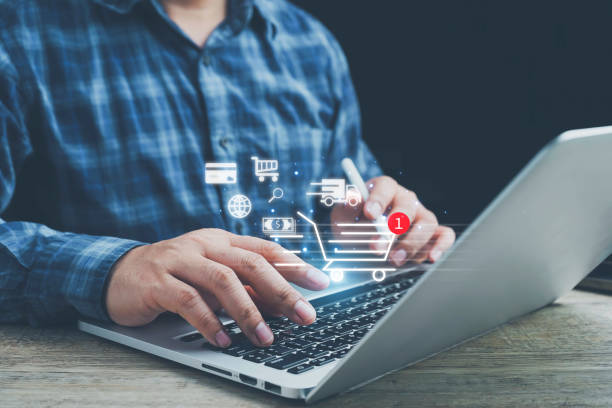 istock shopping online, order in online store, shopping on internet, ,Shopper using computer laptop to input order with trolley credit card delivery truck for online shopping and e-commerce technology. 1978668731