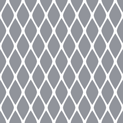 White grid on a gray background. The diamond-shaped shape of the cells. Seamless geometric pattern. Isolated. Background for decor.