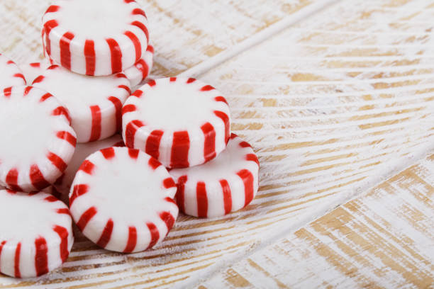 istock Peppermint Candies isolated on a white wooden background with copy space 1978685415
