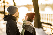 Happy young couple enjoying a winter day together outdoors.