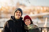 Portrait of happy young couple enjoying a winter day outdoors.