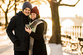 Happy young couple enjoying a winter day together outdoors.