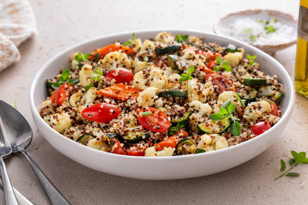 istock Warm quinoa salad with roasted vegetables and fresh tomatoes 1978755122