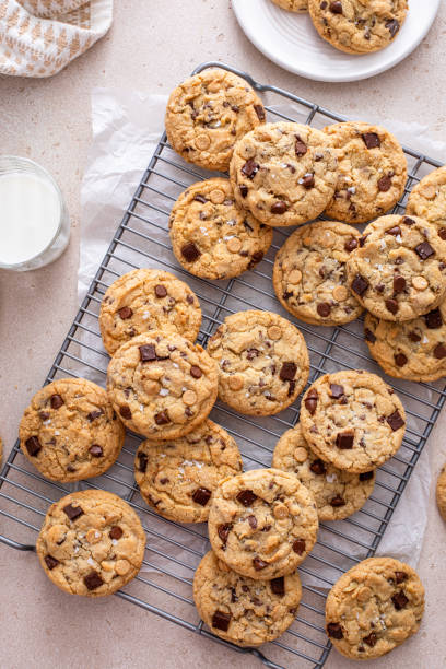 istock Chocolate chip cookies on a cooling rack with flaky salt served with milk 1978755627