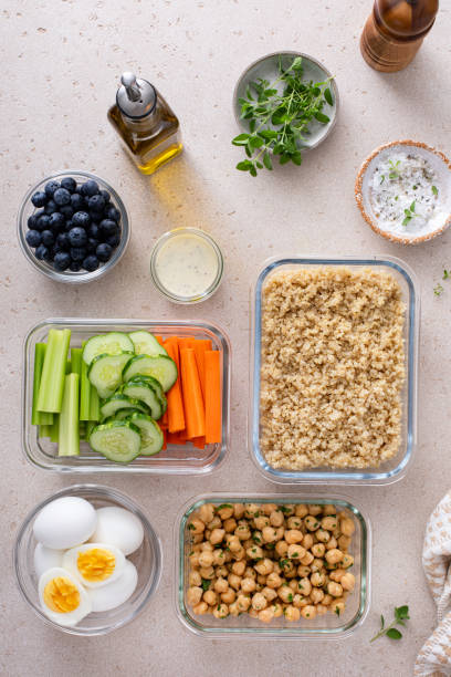 istock Vegetarian lunch meal prep in containers, high protein with quinoa, herbed chickpeas, vegetables and boiled eggs 1978755652