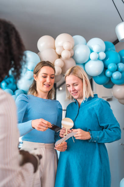 istock Sharing Laughter and Memories at a Baby Shower 1978760901