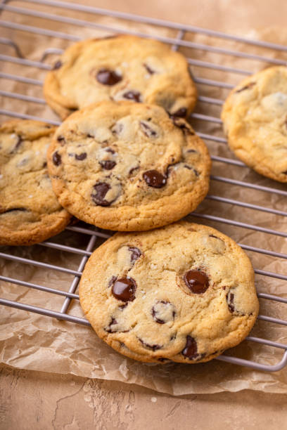istock Chocolate chip cookies freshly baked on parchment paper 1978764007