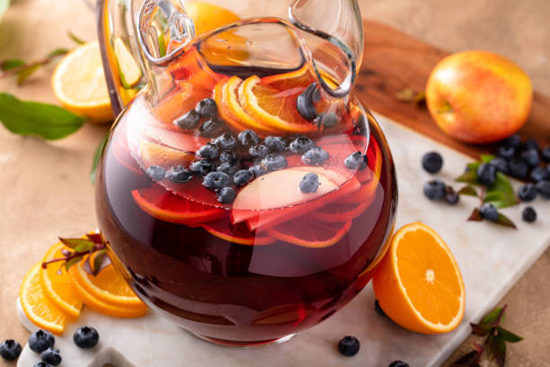 istock Winter orange and berry sangria with sliced oranges and blueberries 1978764025