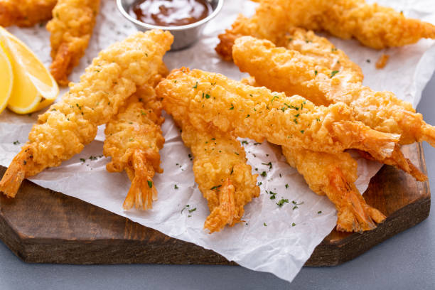istock Cooked tempura shrimp on a serving board with dipping sauce 1978764562