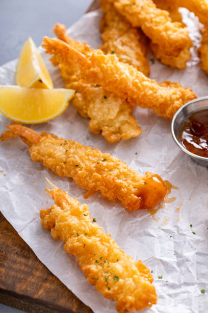 istock Cooked tempura shrimp on a serving board with dipping sauce 1978764564